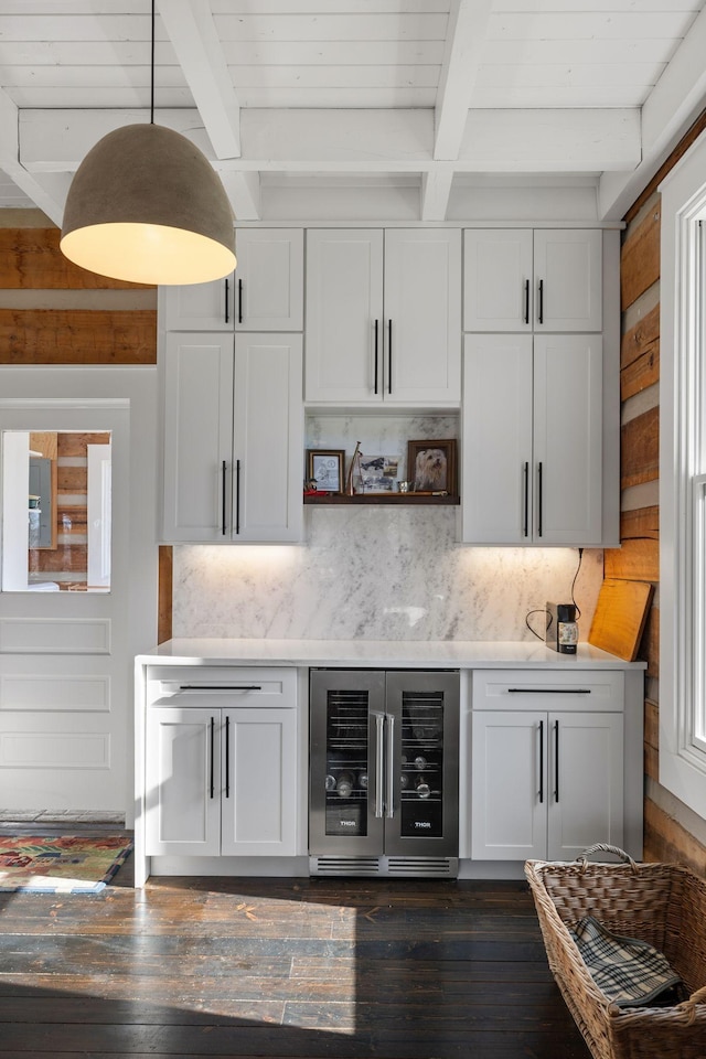 bar with beam ceiling, wine cooler, white cabinets, dark hardwood / wood-style flooring, and decorative backsplash