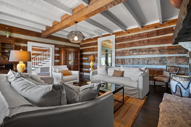 living room featuring dark hardwood / wood-style floors, beamed ceiling, and wood walls