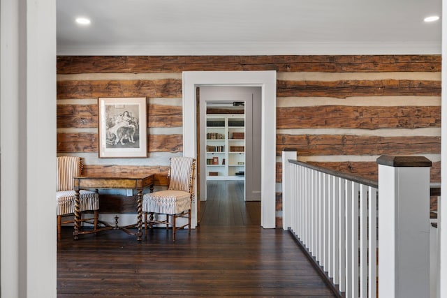 hallway featuring ornamental molding and dark hardwood / wood-style flooring