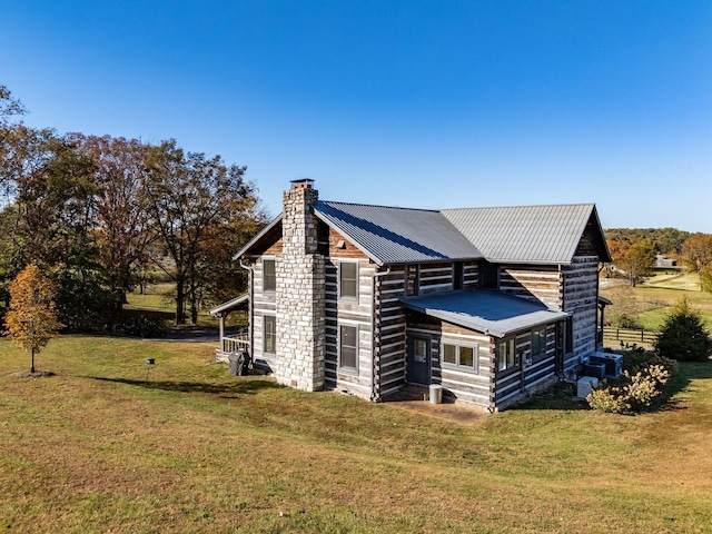 view of home's exterior with a lawn