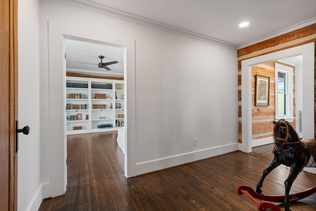 corridor featuring dark hardwood / wood-style flooring and crown molding