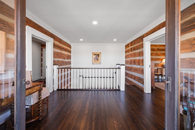 interior space featuring dark wood-type flooring and ornamental molding