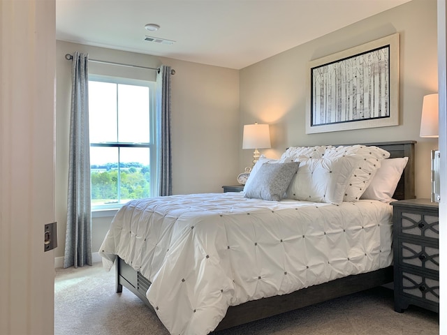 bedroom with light colored carpet