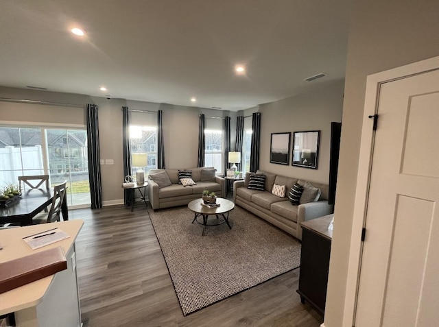 living room with dark hardwood / wood-style flooring