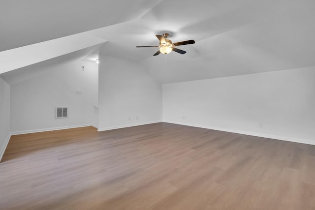 bonus room with ceiling fan, vaulted ceiling, and light hardwood / wood-style flooring