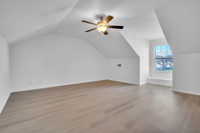 bonus room with ceiling fan, lofted ceiling, and light hardwood / wood-style flooring