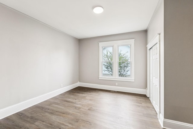 spare room featuring hardwood / wood-style floors