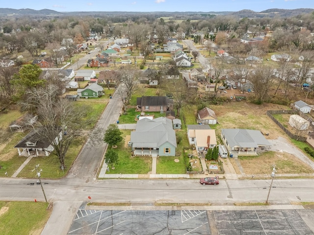 birds eye view of property with a mountain view