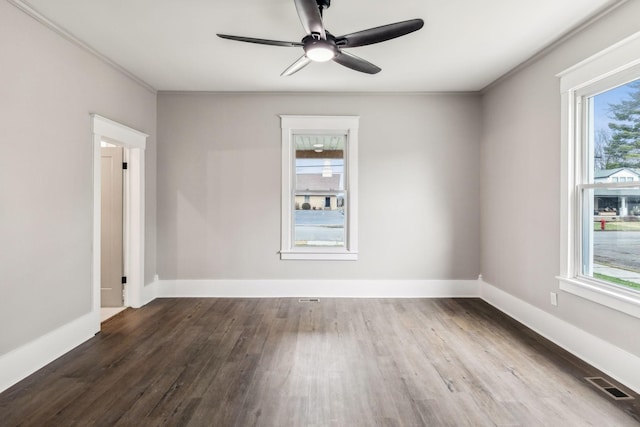 spare room with crown molding, hardwood / wood-style floors, and ceiling fan