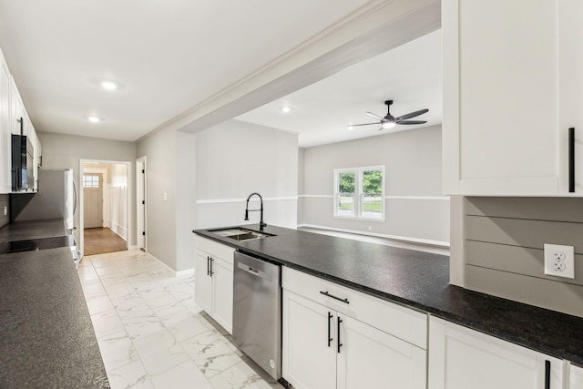 kitchen with sink, stainless steel dishwasher, white cabinets, and ceiling fan