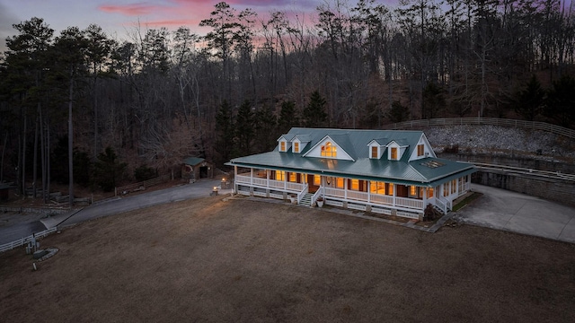 farmhouse-style home featuring a porch