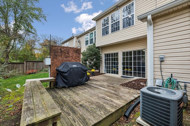 deck featuring central AC and area for grilling