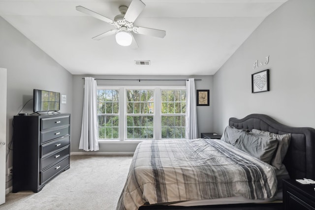 bedroom featuring vaulted ceiling, carpet flooring, and ceiling fan