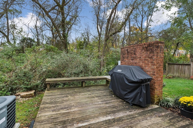 wooden terrace with a grill