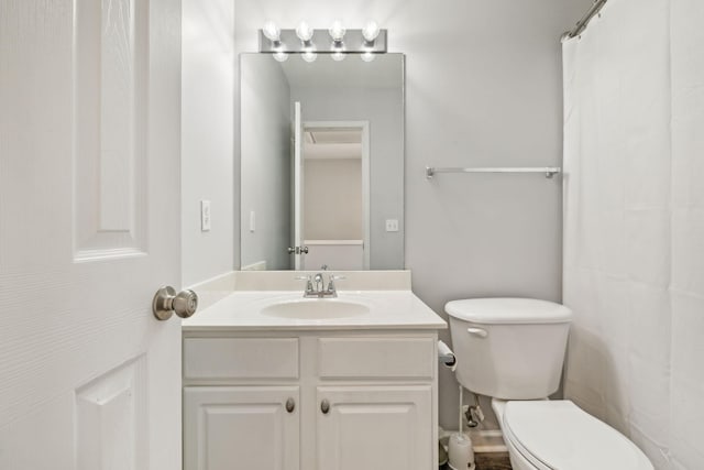 full bathroom with toilet and vanity