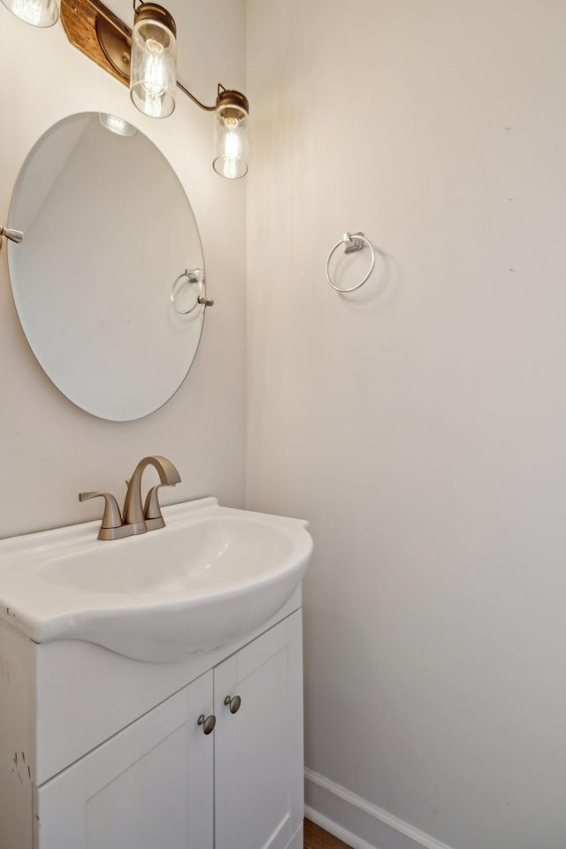 bathroom featuring baseboards and vanity