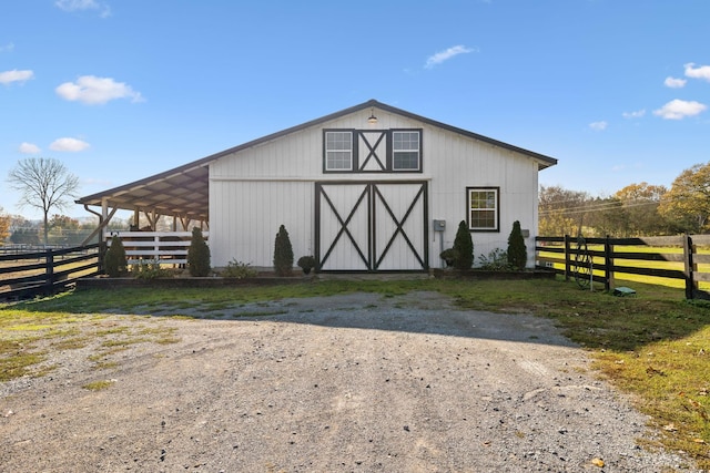 view of outdoor structure with a rural view