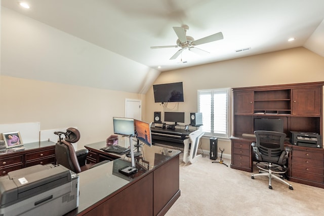 home office with light colored carpet, ceiling fan, and vaulted ceiling