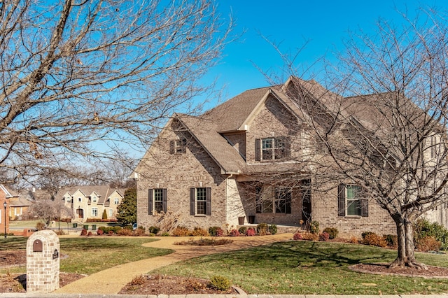 view of front facade with a front yard