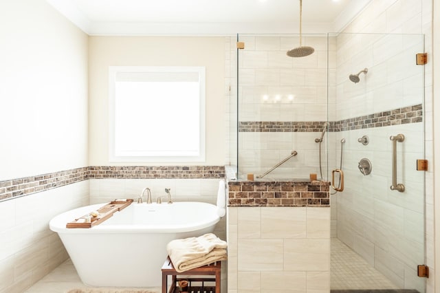 bathroom with tile walls, crown molding, and plus walk in shower