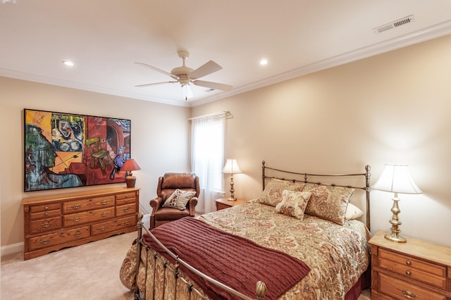 carpeted bedroom featuring crown molding and ceiling fan