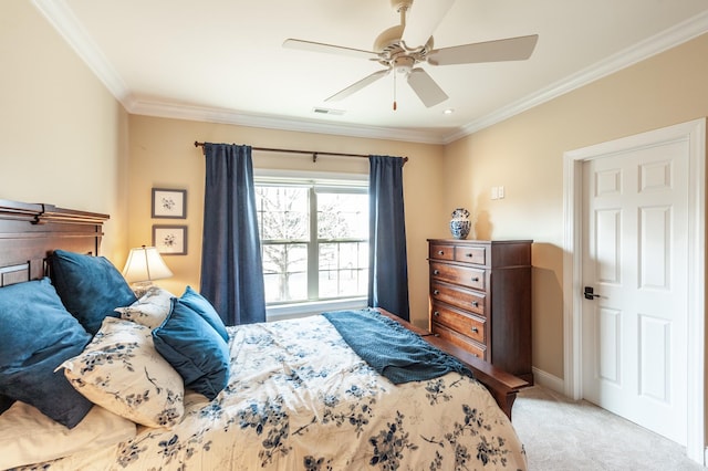 carpeted bedroom featuring crown molding and ceiling fan