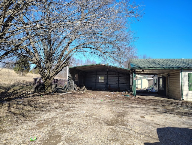 view of home's exterior with a carport