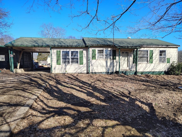 ranch-style house with a carport