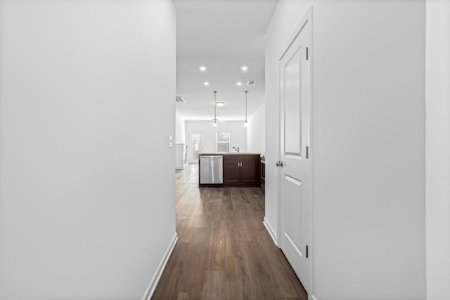 corridor featuring dark hardwood / wood-style floors