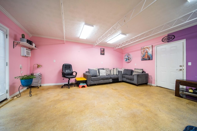 living room featuring crown molding and a wall unit AC