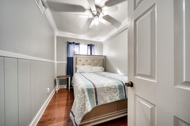 bedroom with dark wood-type flooring, ceiling fan, and ornamental molding