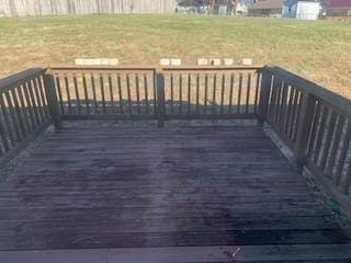 wooden deck with a yard