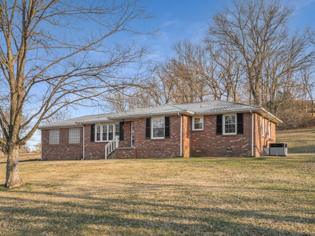 ranch-style home with central AC and a front lawn