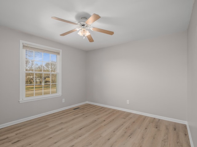 unfurnished room with ceiling fan and light hardwood / wood-style flooring