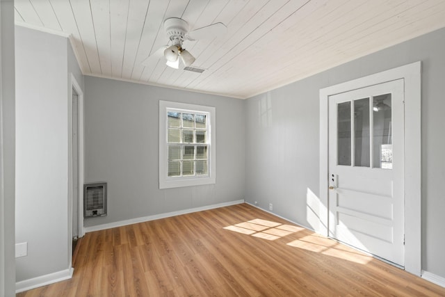 unfurnished room featuring heating unit, crown molding, wooden ceiling, light wood-type flooring, and ceiling fan