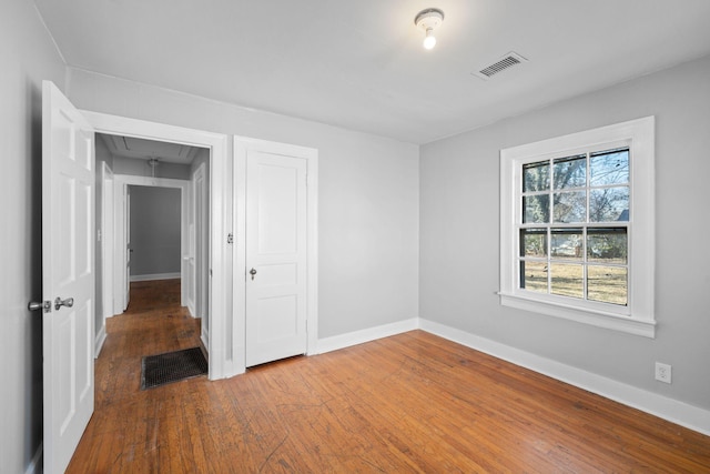 empty room featuring hardwood / wood-style floors