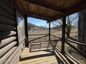 wooden terrace featuring a rural view