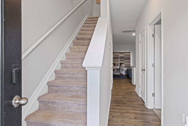 stairway featuring hardwood / wood-style flooring