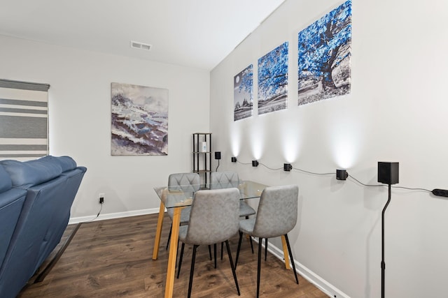 dining room featuring dark wood-type flooring