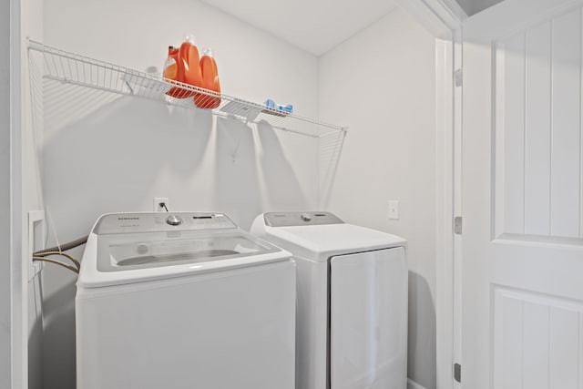 washroom featuring washer and clothes dryer