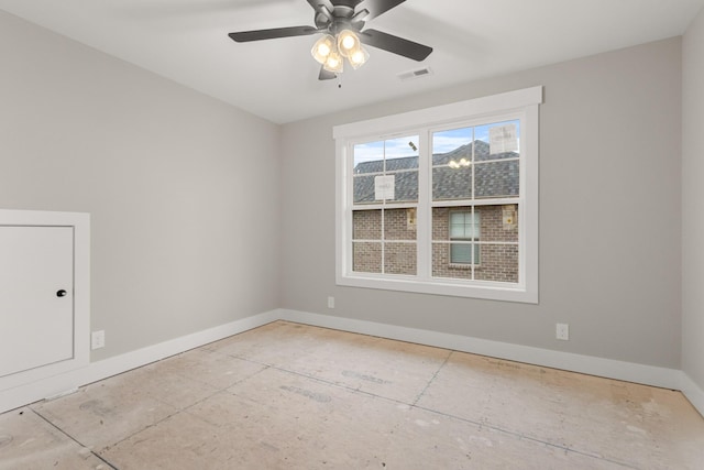 unfurnished room with visible vents, baseboards, and ceiling fan