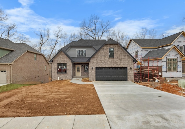 view of front facade with an attached garage, brick siding, driveway, roof with shingles, and crawl space