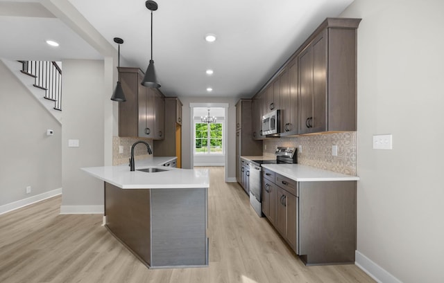 220 Birnam Wood Trce, Clarksville, TN 37043 - kitchen featuring stainless steel appliances, a sink, dark brown cabinetry, and recessed lighting
