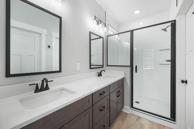 220 Birnam Wood Trce, Clarksville, TN 37043 - full bathroom with a shower stall, wood finished floors, and double vanity