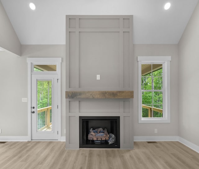 220 Birnam Wood Trce, Clarksville, TN 37043 - unfurnished living room with a fireplace, wood finished floors, lofted ceiling, baseboards, and recessed lighting