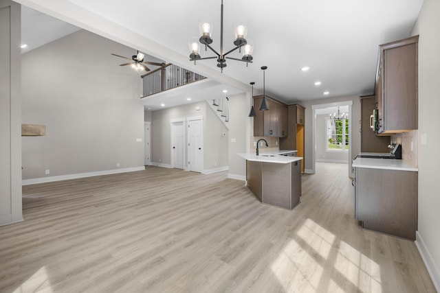 220 Birnam Wood Trce, Clarksville, TN 37043 - kitchen featuring a chandelier, a ceiling fan, open floor plan, light wood-type flooring, and light countertops