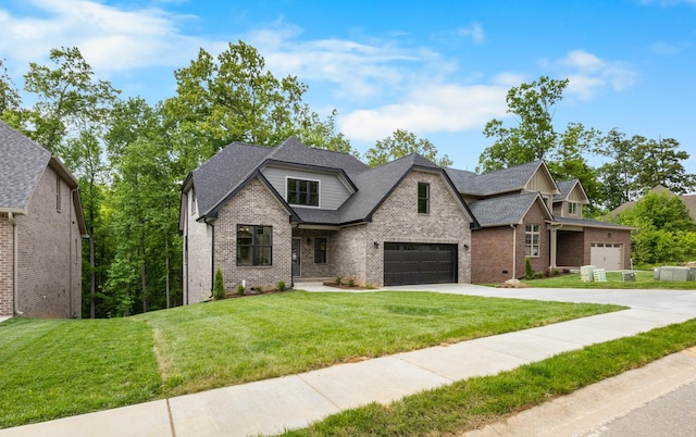 220 Birnam Wood Trce, Clarksville, TN 37043 - view of front of property featuring brick siding, driveway, a front yard, a garage, and roof with shingles