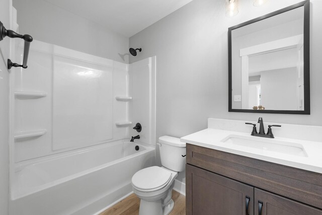 220 Birnam Wood Trce, Clarksville, TN 37043 - full bathroom featuring wood finished floors, toilet, vanity, and washtub / shower combination