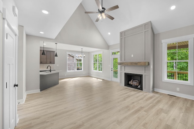 220 Birnam Wood Trce, Clarksville, TN 37043 - unfurnished living room featuring a chandelier, baseboards, high vaulted ceiling, a ceiling fan, and recessed lighting