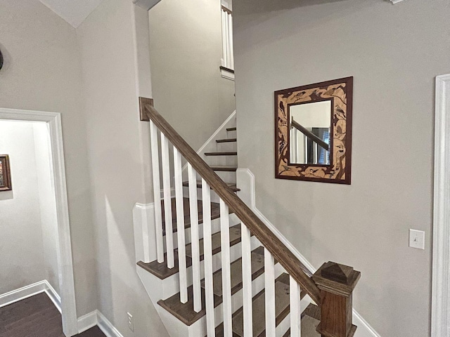 stairway featuring hardwood / wood-style flooring